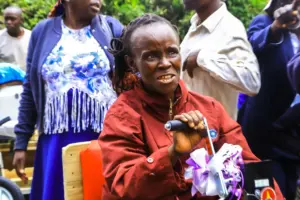 A woman smiles when she received a wheel chair. She is one of the 26 beneficiaires who were happy for the support .