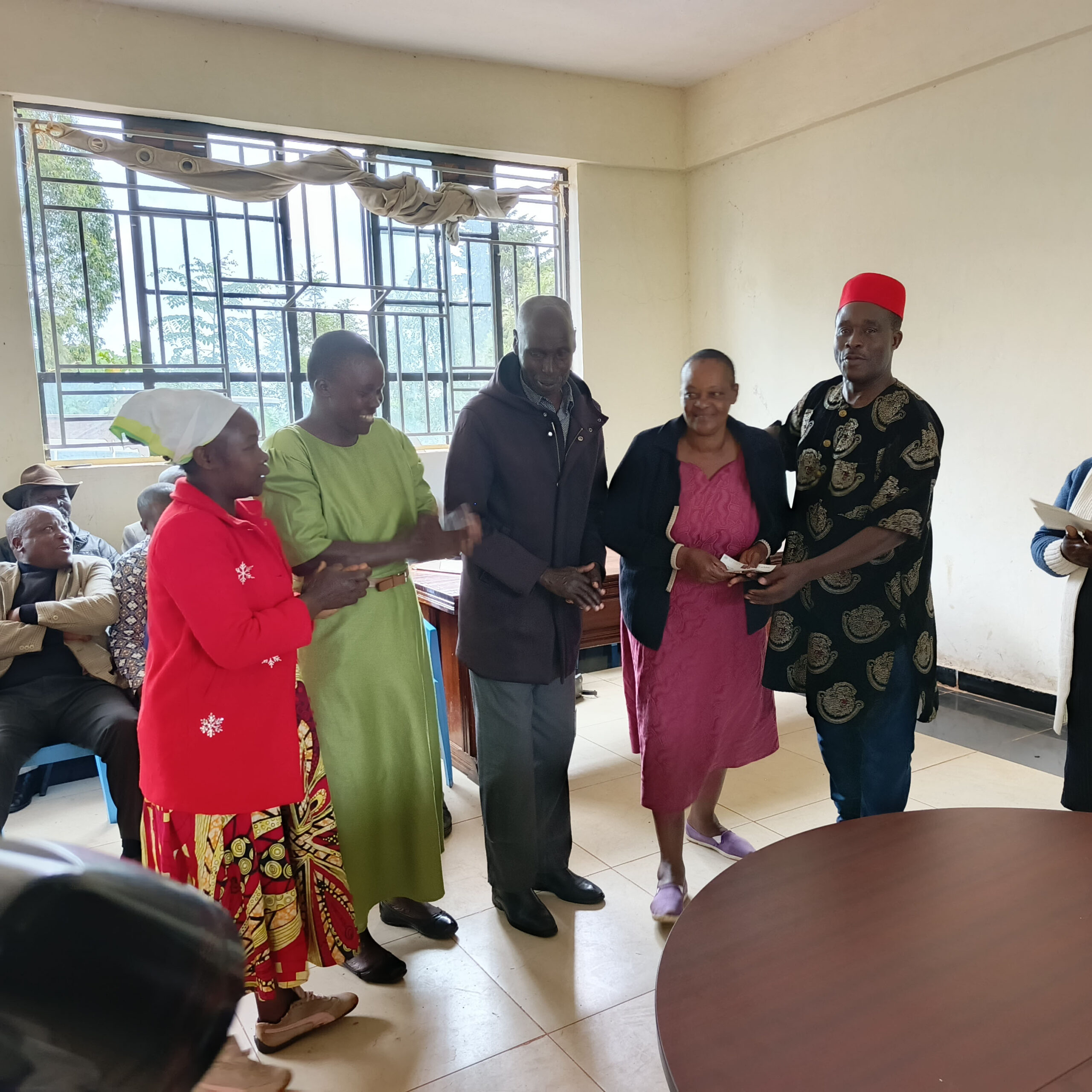 West Mugirango MP Stephen Mogaka issuing a cheque to one of the women's self-help groups during the relaunch of the Uwezo Fund in West Mugirango Constituency. Photo/Arnold Ageta.