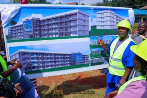 West Mugirango MP, Stephen Mogaka, explains the features of the illustration of the proposed four-story classroom building at Nyamira Primary School. Mogaka has urged elected officials from Nyamira County to set aside their personal interests and support the establishment of the proposed Nyamira University.