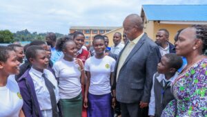 Governor Amos Nyaribo takes a photo with Form Four students who are in a one-week mentorship program at Nyambaria Boys. This is a section of the 731 secondary school students who are under the county's scholarship program.