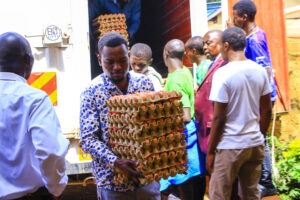 Nyamira Conference Delegates offloading eggs doonated by Waletr Chanua at Nyambaria Boys.