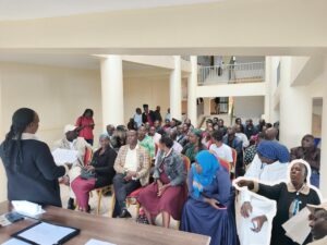 Nyamira County Health Promoter Jackline Nyamusi leads a sensitization exercise at Nyamira County Referral Hospital for the upcoming typhoid and measles-rubella vaccination campaign. Photo/Arnold Ageta.