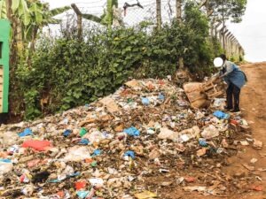 A boy dumping garbage at Kebriog market. Photo/Arnold Ageta