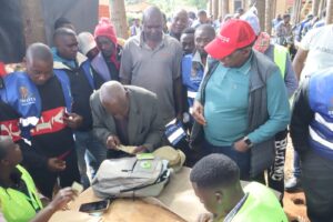 Wiper National Vice Chairman Victor Swanya observes as a resident verifies their registration details at Gesima, Nyamira County. Swanya was in the region to launch the ‘Niko KADI’ campaign, a youth-led initiative aimed at boosting voter numbers ahead of the 2027 General Election.