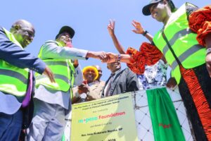 Nominated MP Irene Mayaka and West Mugirango MP Stephen Mogaka shake hands during the site handing-over ceremony for the construction of improved school infrastructure at Otanyore Secondary School. Photo/Arnold Ageta