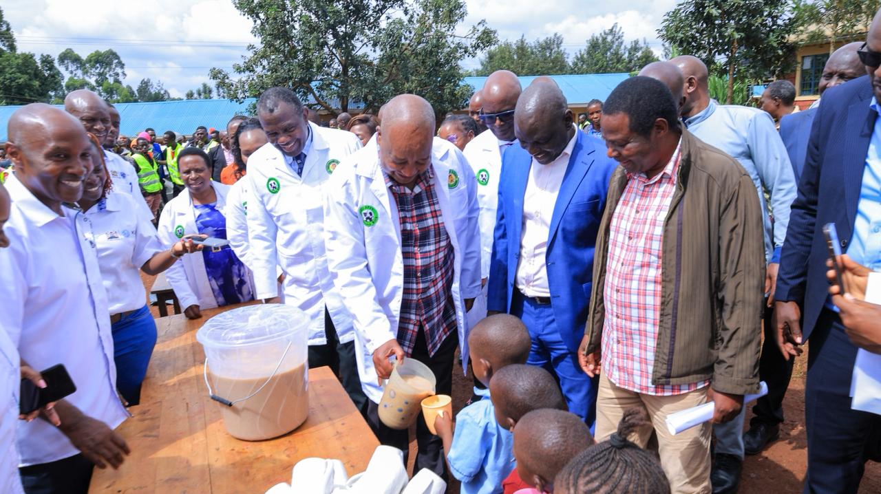 Nyamira Governor Amos Nyaribo serves fortified porridge to a learner at Riomoro ECDE Centre during the official launch of the UjiAfya Masomo Bora Programme. Photo/Governor's Press Unit