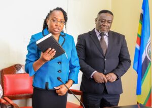 Nyamira County Public Service Board Chair, Ambassador Jackline Moraa, takes her oath of office during the swearing-in ceremony as Nyamira Chief Magistrate Benard Ochieng looks on. Photo/Arnold Ageta