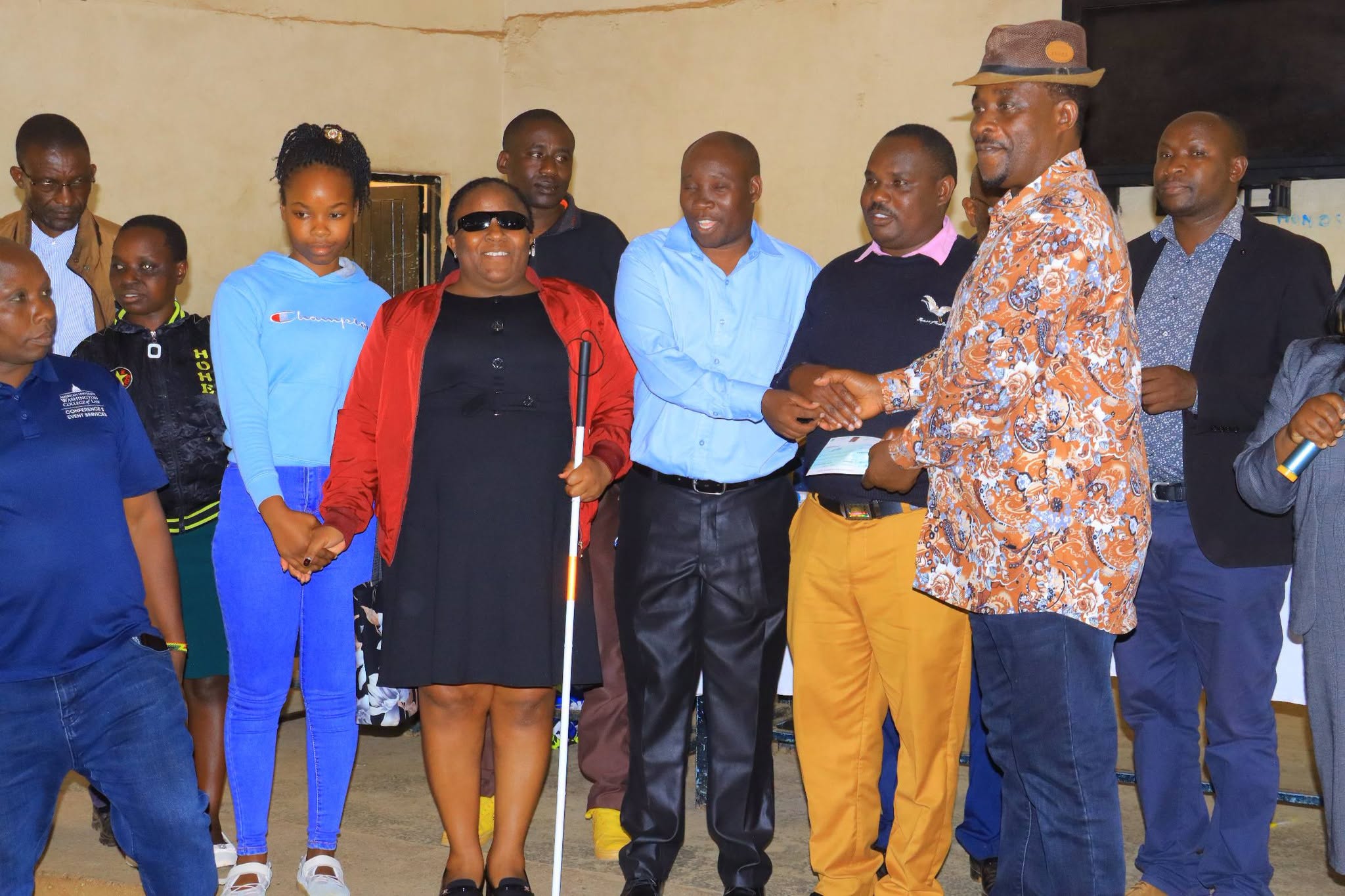 West Mugirango MP Stephen Mogaka and members of a beneficiary group pose for a photo during the issuance of Uwezo Fund cheques at Kebirigo Boys High School. Photo/Arnold Ageta