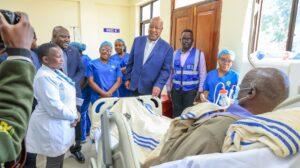 • Governor Nyaribo speaks with a patient undergoing a dialysis session during his tour of the new renal unit, accompanied by the hospital’s medical staff. Photo/Arnold Ageta