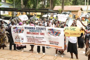 Striking Nyamira County ECDE teachers wait at the county headquarters as they seek an address from county officials. Photo/Arnold Ageta