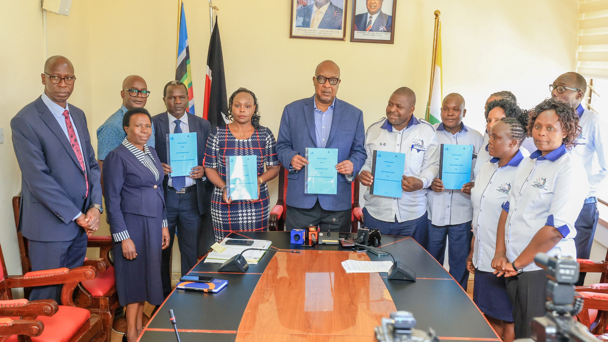 Nyamira Governor, Amos Nyaribo (centre) joins KUNoPPET officials, County Service Board Members, and other officials after signing the recognition agreement. Photo/Arnold Ageta